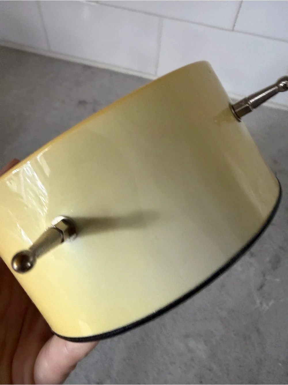 Vintage yellow Karlsson Chaplin alarm clock features a distinctive minimalist